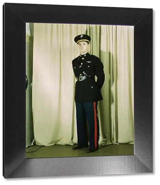 Marine Corps Captain in dress blue uniform, World War II, between 1941 and 1945. Creator: Howard Hollem