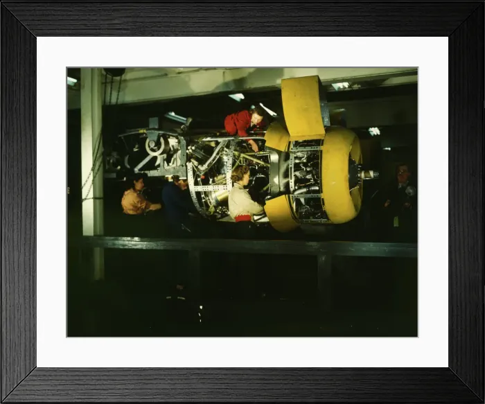 Framed Print : Installing one of the 4 motors on the transport plane at Willow Run, between 1941 and 1945. Creator: Howard Hollem Framed Print : Installing one of the 4 motors on the transport plane at Willow Run, between 1941 and 1945. Creator: Howard Hollem