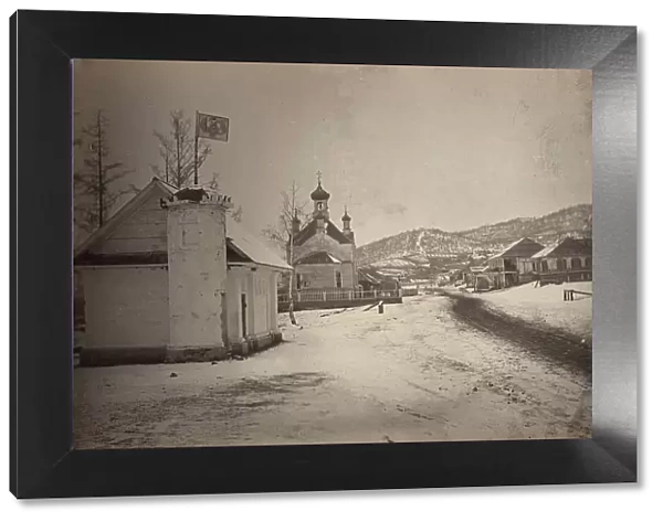 View of a settlement or village with a government(?) building and a church... between 1885 and 86. Creator: Unknown
