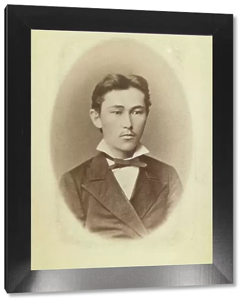 Half-length portrait of a young man, facing slightly right, between 1870 and 1886. Creator: Unknown