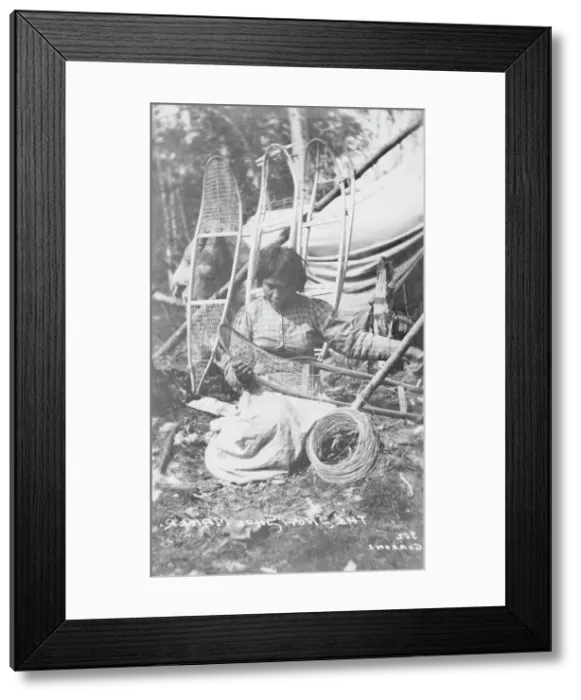 Framed Print : Woman making snow shoes, between c1900 and c1930. Creator: Unknown Framed Print : Woman making snow shoes, between c1900 and c1930. Creator: Unknown