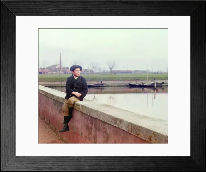 Framed Print : Boy sitting on sea wall, between 1905 and 1915. Creator: Sergey Mikhaylovich Prokudin-Gorsky Framed Print : Boy sitting on sea wall, between 1905 and 1915. Creator: Sergey Mikhaylovich Prokudin-Gorsky