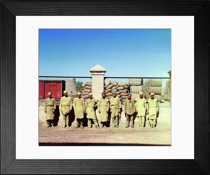 Framed Print : Group of labourers in front of a chain-link fence, between 1905-1915. Creator: Sergey Mikhaylovich Prokudin-Gorsky