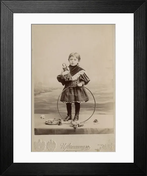 Framed Print : Portrait of a girl with a hoop and a doll, 1900. Creator: I. Antonopulo