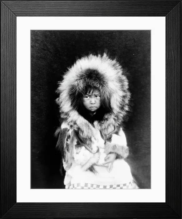 Framed Print : Noatak child, three-quarter length portrait, seated, facing front, c1929. Creator: Edward Sheriff Curtis Framed Print : Noatak child, three-quarter length portrait, seated, facing front, c1929. Creator: Edward Sheriff Curtis