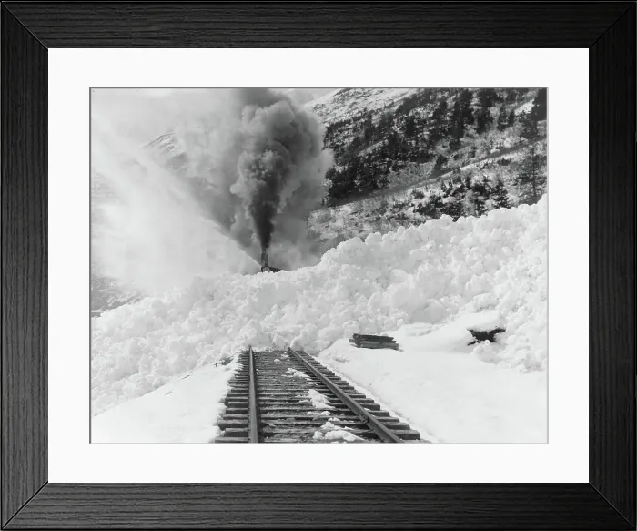 Framed Print : Avalanche of snow across railroad tracks, between 1890 and 1930. Creator: Frank G. Carpenter