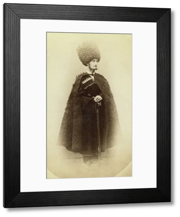 Framed Print : Full-length portrait of a man in cape and sheep skin hat, holding a rifle... between 1870 and 86. Creator: Unknown Framed Print : Full-length portrait of a man in cape and sheep skin hat, holding a rifle... between 1870 and 86. Creator: Unknown