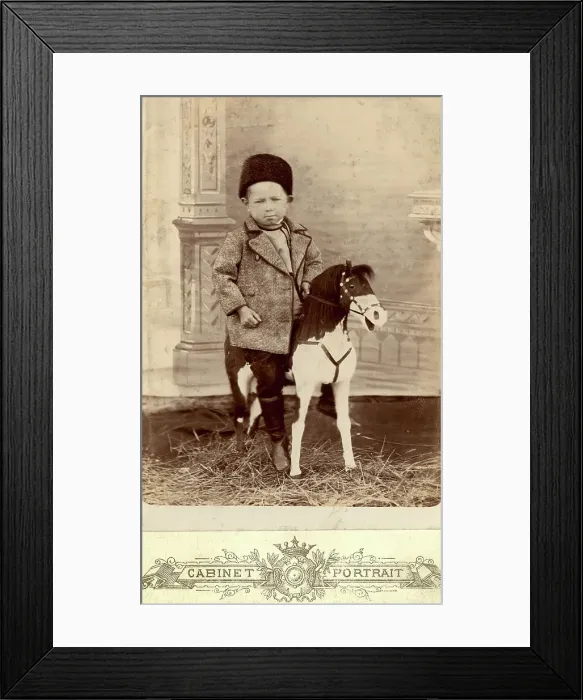Framed Print : Portrait of a boy sitting on a toy horse, late 19th cent - early 20th cent. Creator: Unknown Framed Print : Portrait of a boy sitting on a toy horse, late 19th cent - early 20th cent. Creator: Unknown