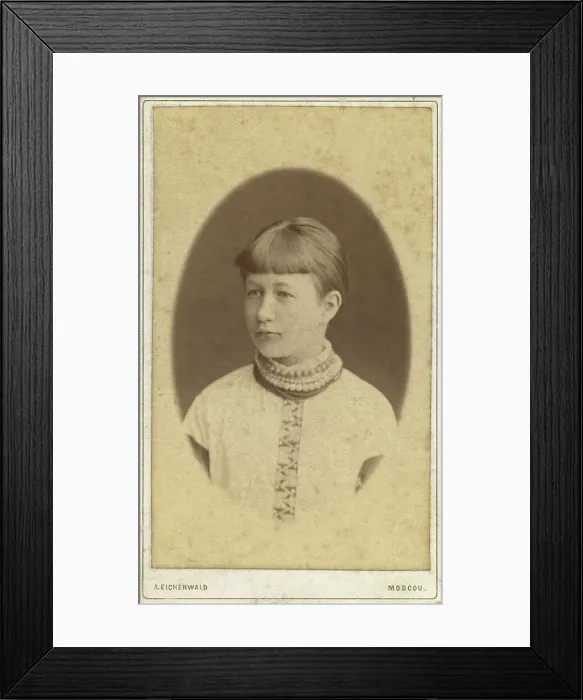 Framed Print : Head-and-shoulders portrait of a young woman, facing left, between 1880 and 1886. Creator: Unknown Framed Print : Head-and-shoulders portrait of a young woman, facing left, between 1880 and 1886. Creator: Unknown