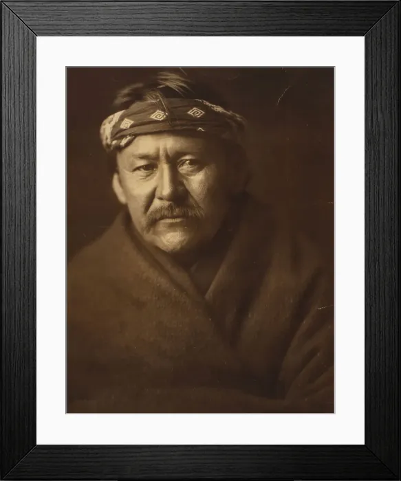 Framed Print : A Navajo man, head-and-shoulders portrait, wearing blanket and headband, facing front, c1904. Creator: Edward Sheriff Curtis Framed Print : A Navajo man, head-and-shoulders portrait, wearing blanket and headband, facing front, c1904. Creator: Edward Sheriff Curtis
