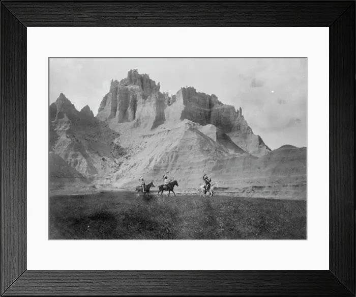 Framed Print : Entering the Bad Lands. Three Sioux Indians on horseback, c1905. Creator: Edward Sheriff Curtis Framed Print : Entering the Bad Lands. Three Sioux Indians on horseback, c1905. Creator: Edward Sheriff Curtis