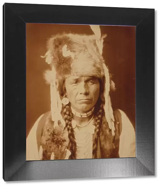 Nez Percé with furcap, c1904. Creator: Edward Sheriff Curtis