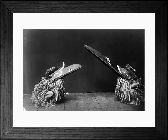 Framed Print : Kotsuis and Hohhug-Nakoaktok, wearing ceremonial dress, with long beaks, on their haunches... c1914 Creator: Edward Sheriff Curtis Framed Print : Kotsuis and Hohhug-Nakoaktok, wearing ceremonial dress, with long beaks, on their haunches... c1914 Creator: Edward Sheriff Curtis
