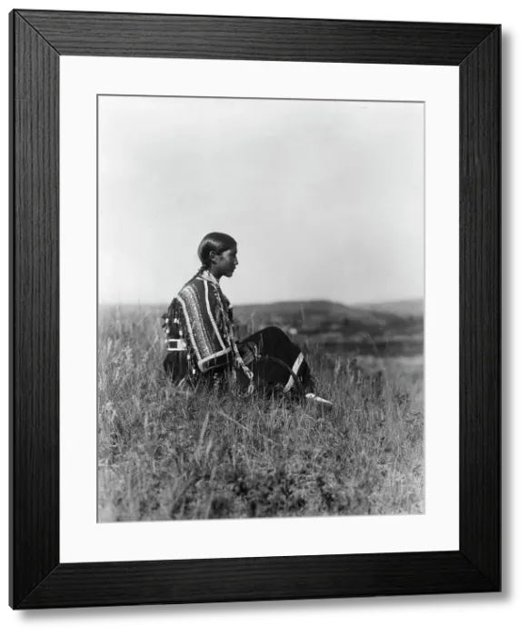 Framed Print : Day dreams-Piegan, c1910. Creator: Edward Sheriff Curtis Framed Print : Day dreams-Piegan, c1910. Creator: Edward Sheriff Curtis