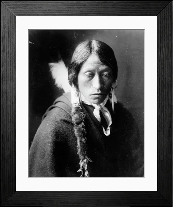 Framed Print : Jicarilla man, head-and-shoulders portrait, facing slightly right, with fur wrapped braids... c1905 Creator: Edward Sheriff Curtis Framed Print : Jicarilla man, head-and-shoulders portrait, facing slightly right, with fur wrapped braids... c1905 Creator: Edward Sheriff Curtis