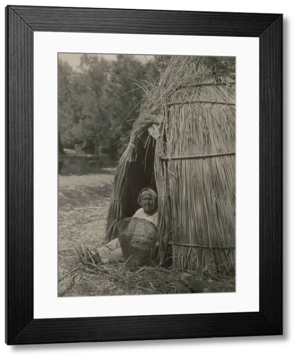 Framed Print : Construction of a tule shelter-lake Pomo, 1924. Creator: Edward Sheriff Curtis Framed Print : Construction of a tule shelter-lake Pomo, 1924. Creator: Edward Sheriff Curtis