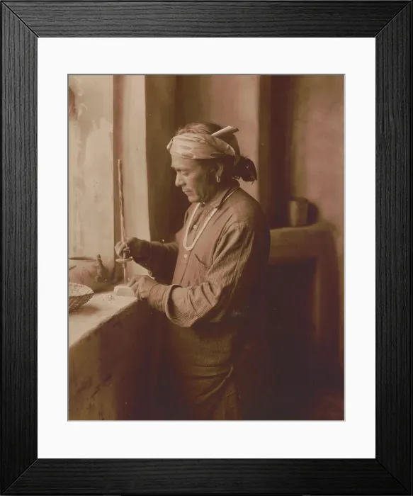 Framed Print : Zuni Indian bead worker drilling holes in beads, c1903. Creator: Edward Sheriff Curtis Framed Print : Zuni Indian bead worker drilling holes in beads, c1903. Creator: Edward Sheriff Curtis