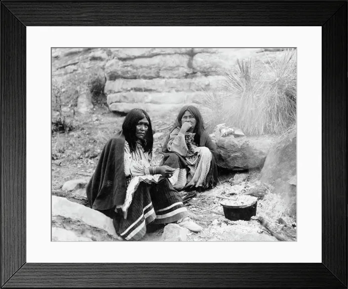 Framed Print : Two Apache Indian women at campfire, cooking pot in front of one, c1903. Creator: Edward Sheriff Curtis Framed Print : Two Apache Indian women at campfire, cooking pot in front of one, c1903. Creator: Edward Sheriff Curtis