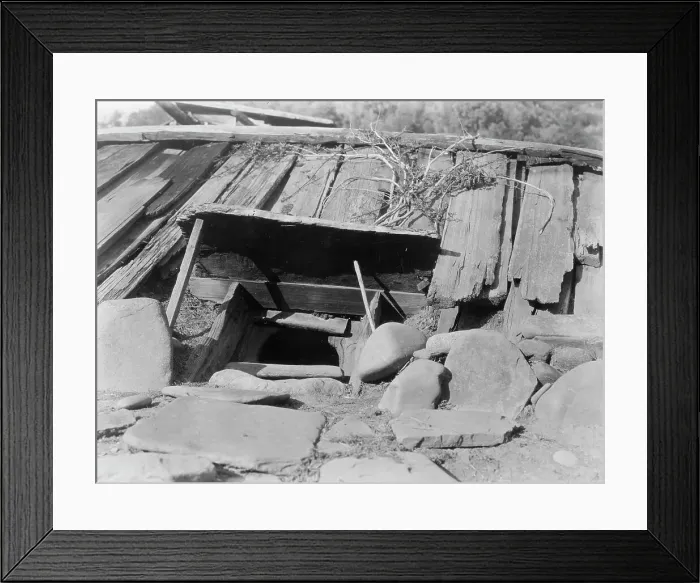 Framed Print : Entrance to a Yurok Sweat-house, c1923. Creator: Edward Sheriff Curtis Framed Print : Entrance to a Yurok Sweat-house, c1923. Creator: Edward Sheriff Curtis