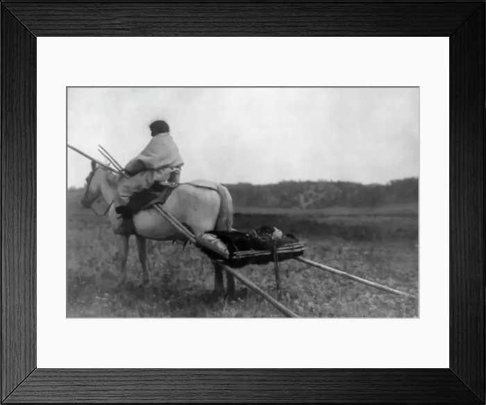 Framed Print : Atsina Indian on horse pulling travois, c1908. Creator: Edward Sheriff Curtis Framed Print : Atsina Indian on horse pulling travois, c1908. Creator: Edward Sheriff Curtis