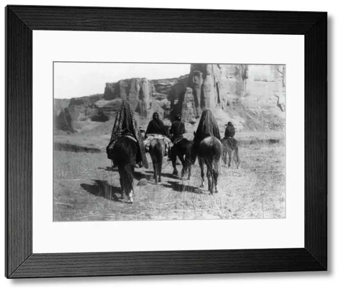 Framed Print : March through Tesacod Canyon, c1905. Creator: Edward Sheriff Curtis Framed Print : March through Tesacod Canyon, c1905. Creator: Edward Sheriff Curtis