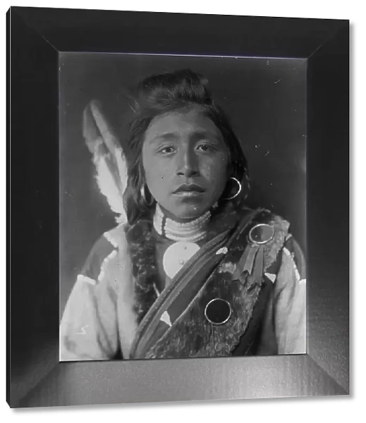 Kashhila-Wishham. Male Chinookan Indian, head-and-shoulders portrait, facing front... c1910. Creator: Edward Sheriff Curtis