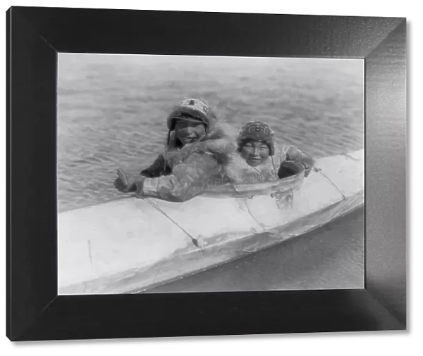 Boys in a kaiak (i.e. kayak)-Nunivak, c1929. Creator: Edward Sheriff Curtis