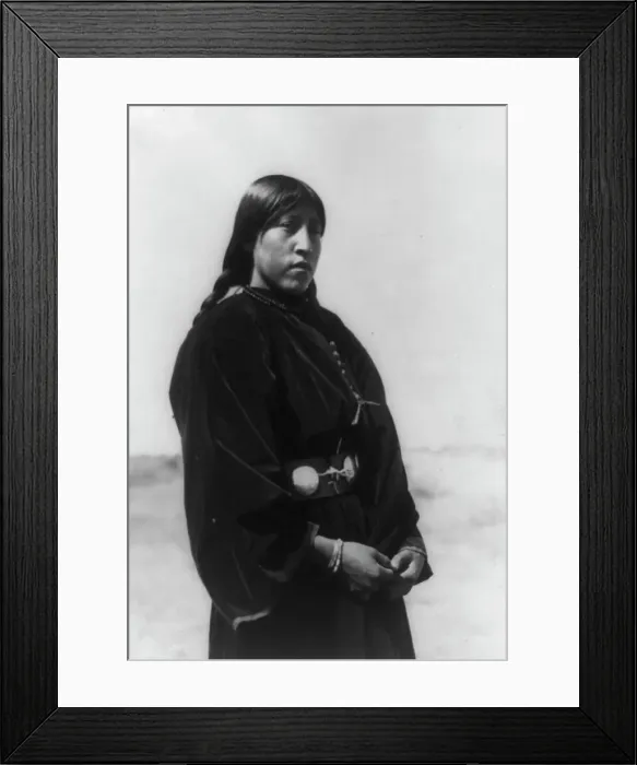 Framed Print : Arapaho maiden, three-quarter-length portrait, standing, facing right, c1910. Creator: Edward Sheriff Curtis Framed Print : Arapaho maiden, three-quarter-length portrait, standing, facing right, c1910. Creator: Edward Sheriff Curtis