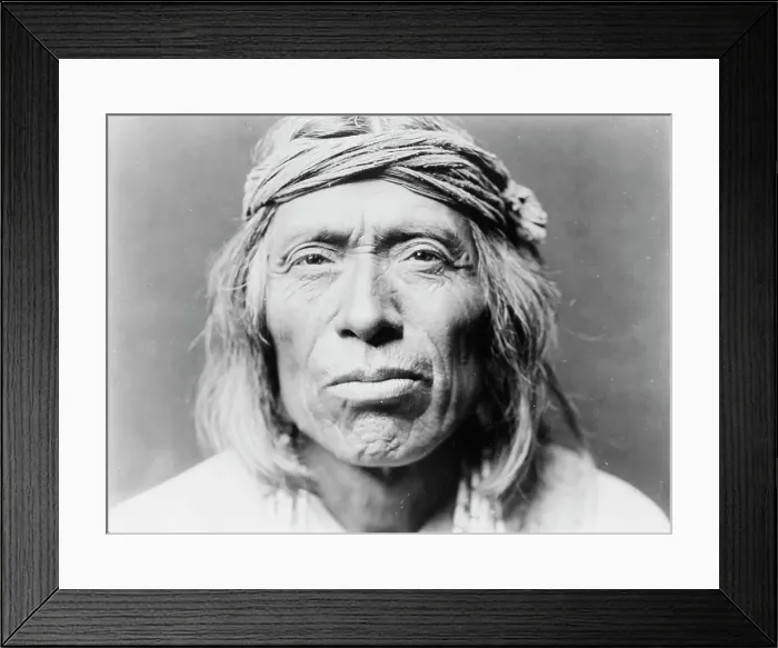 Framed Print : Head-and-shoulders portrait of Shiwawatiwa, a Zuni Indian, facing front, c1903. Creator: Edward Sheriff Curtis Framed Print : Head-and-shoulders portrait of Shiwawatiwa, a Zuni Indian, facing front, c1903. Creator: Edward Sheriff Curtis