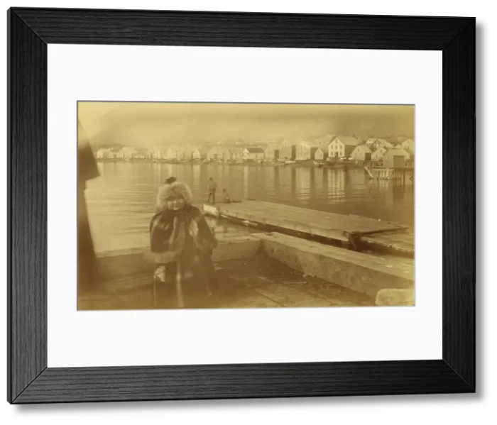 Framed Print : Unidentified young girl standing on wharf, with buildings along waterfront...1894 or 1895. Creator: Alfred Lee Broadbent Framed Print : Unidentified young girl standing on wharf, with buildings along waterfront...1894 or 1895. Creator: Alfred Lee Broadbent
