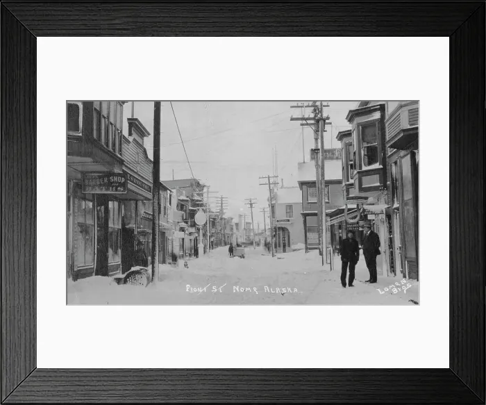 Framed Print : Front Street covered with snow, between c1900 and c1930. Creator: Lomen Brothers Framed Print : Front Street covered with snow, between c1900 and c1930. Creator: Lomen Brothers