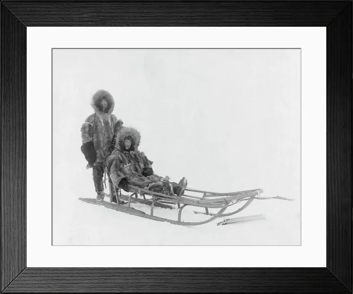 Framed Print : Couple on dog sled, between c1900 and 1927. Creator: Lomen Brothers Framed Print : Couple on dog sled, between c1900 and 1927. Creator: Lomen Brothers