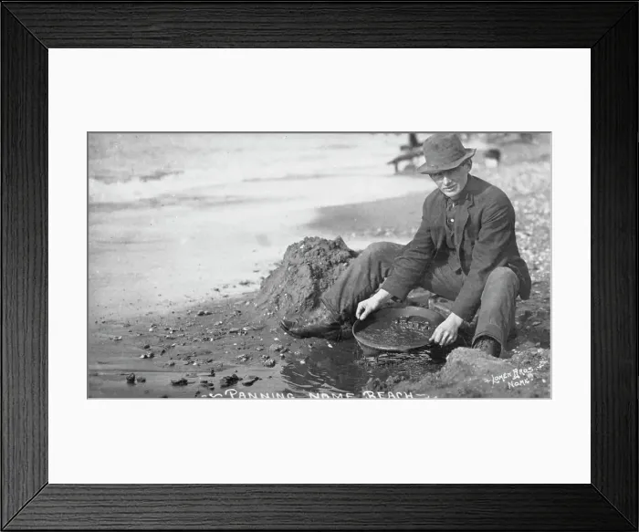 Framed Print : Man panning gold on Nome Beach, between c1900 and c1930. Creator: Lomen Brothers Framed Print : Man panning gold on Nome Beach, between c1900 and c1930. Creator: Lomen Brothers