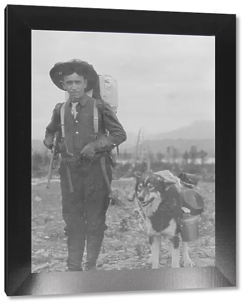 Prospector and dog ready for the summer trail, between c1900 and 1916. Creator: Unknown