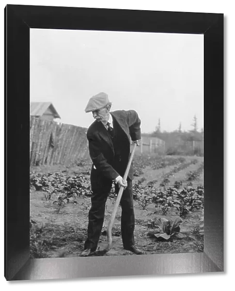 Frank G. Carpenter in a garden, between c1900 and 1916. Creator: Unknown