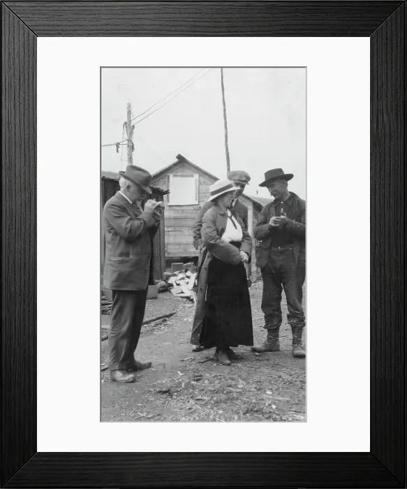 Framed Print : Woman and three men talking outside, between c1900 and 1916. Creator: Unknown Framed Print : Woman and three men talking outside, between c1900 and 1916. Creator: Unknown
