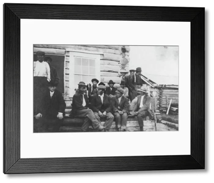 Framed Print : Indigenous peoples outside of log building, between c1900 and 1916. Creator: Unknown Framed Print : Indigenous peoples outside of log building, between c1900 and 1916. Creator: Unknown
