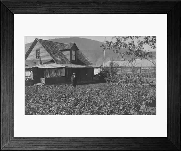 Framed Print : Man in frontyard of house, between c1900 and 1916. Creator: Unknown Framed Print : Man in frontyard of house, between c1900 and 1916. Creator: Unknown