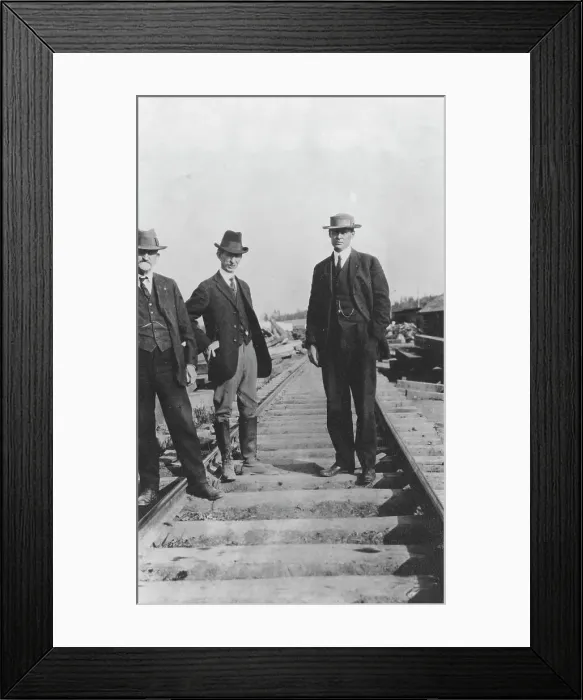 Framed Print : At the new railroad left to right are: Mr. Edes, Frank G. Carpenter... between c1900 and 1916. Creator: Unknown Framed Print : At the new railroad left to right are: Mr. Edes, Frank G. Carpenter... between c1900 and 1916. Creator: Unknown