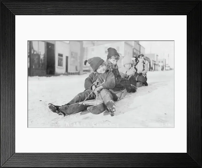 Framed Print : Children sleigh riding, between c1900 and c1930. Creator: Unknown Framed Print : Children sleigh riding, between c1900 and c1930. Creator: Unknown