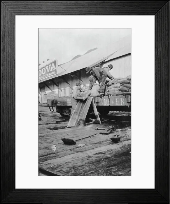 Framed Print : Loading copper, between c1900 and c1930. Creator: Unknown Framed Print : Loading copper, between c1900 and c1930. Creator: Unknown