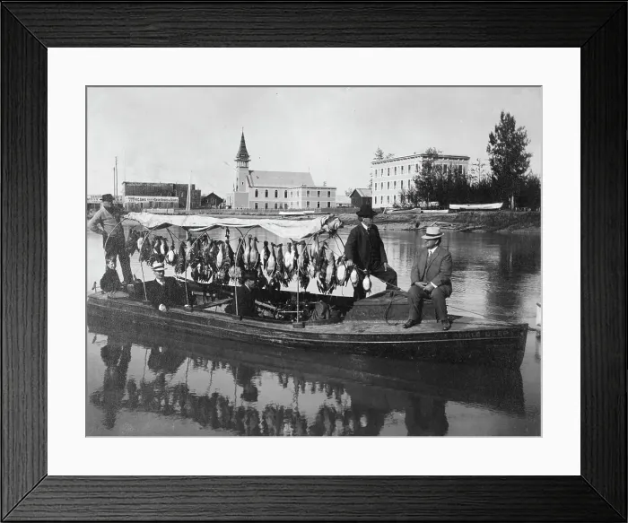 Framed Print : Marshall Erwin in front of a boat containing a kill of ducks, between c1900 and 1927. Creator: Unknown Framed Print : Marshall Erwin in front of a boat containing a kill of ducks, between c1900 and 1927. Creator: Unknown