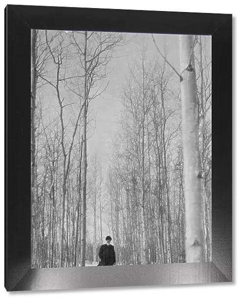 Rev. Burgess on snow covered road, between c1900 and 1927. Creator: Unknown