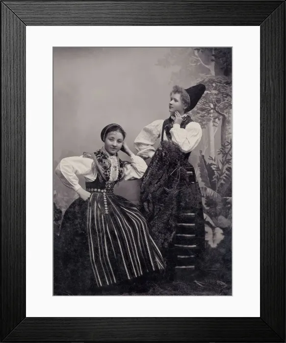 Framed Print : Studio portrait of two young girls posing in folk costumes from Dalarna, 1880-1907. Creator: Helene Edlund Framed Print : Studio portrait of two young girls posing in folk costumes from Dalarna, 1880-1907. Creator: Helene Edlund