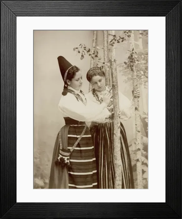 Framed Print : Two young women pose in different national costumes, 1890-1920. Creator: Helene Edlund Framed Print : Two young women pose in different national costumes, 1890-1920. Creator: Helene Edlund