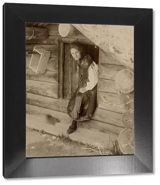 Girl looks out from a doorway, 1890-1920. Creator: Helene Edlund