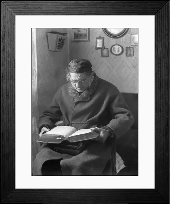 Framed Print : An elderly man sits and reads a book, 1880-1910. Creator: Johan Severin Nilson Framed Print : An elderly man sits and reads a book, 1880-1910. Creator: Johan Severin Nilson