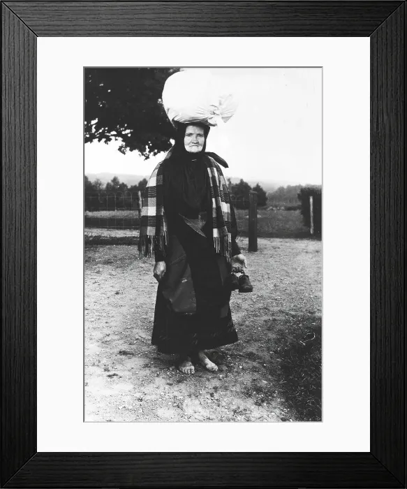 Framed Print : Barefoot woman carrying a sack on her head, walking to sell tissues, Mark's district... 1900-1910. Creator: Unknown Framed Print : Barefoot woman carrying a sack on her head, walking to sell tissues, Mark's district... 1900-1910. Creator: Unknown
