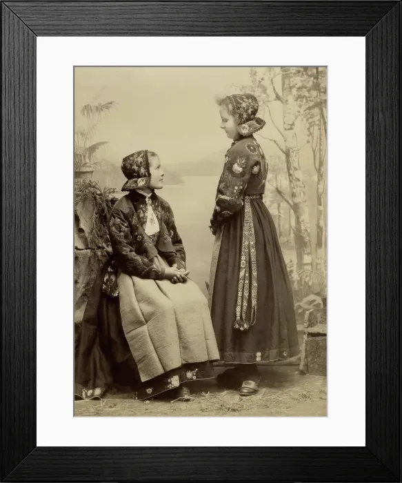 Framed Print : Two young girls pose in costumes from Dala-Floda with floral jackets and hats, 1890-1900. Creator: Helene Edlund Framed Print : Two young girls pose in costumes from Dala-Floda with floral jackets and hats, 1890-1900. Creator: Helene Edlund