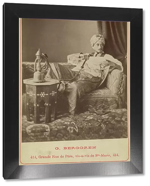 Marquis Claes Lagergren (1853-1930) in eastern costume smoking a hookah. Creator: Guillaume Berggren